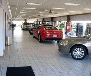 Image of cars cars parked back to back in Pat Clemons Inc. showroom